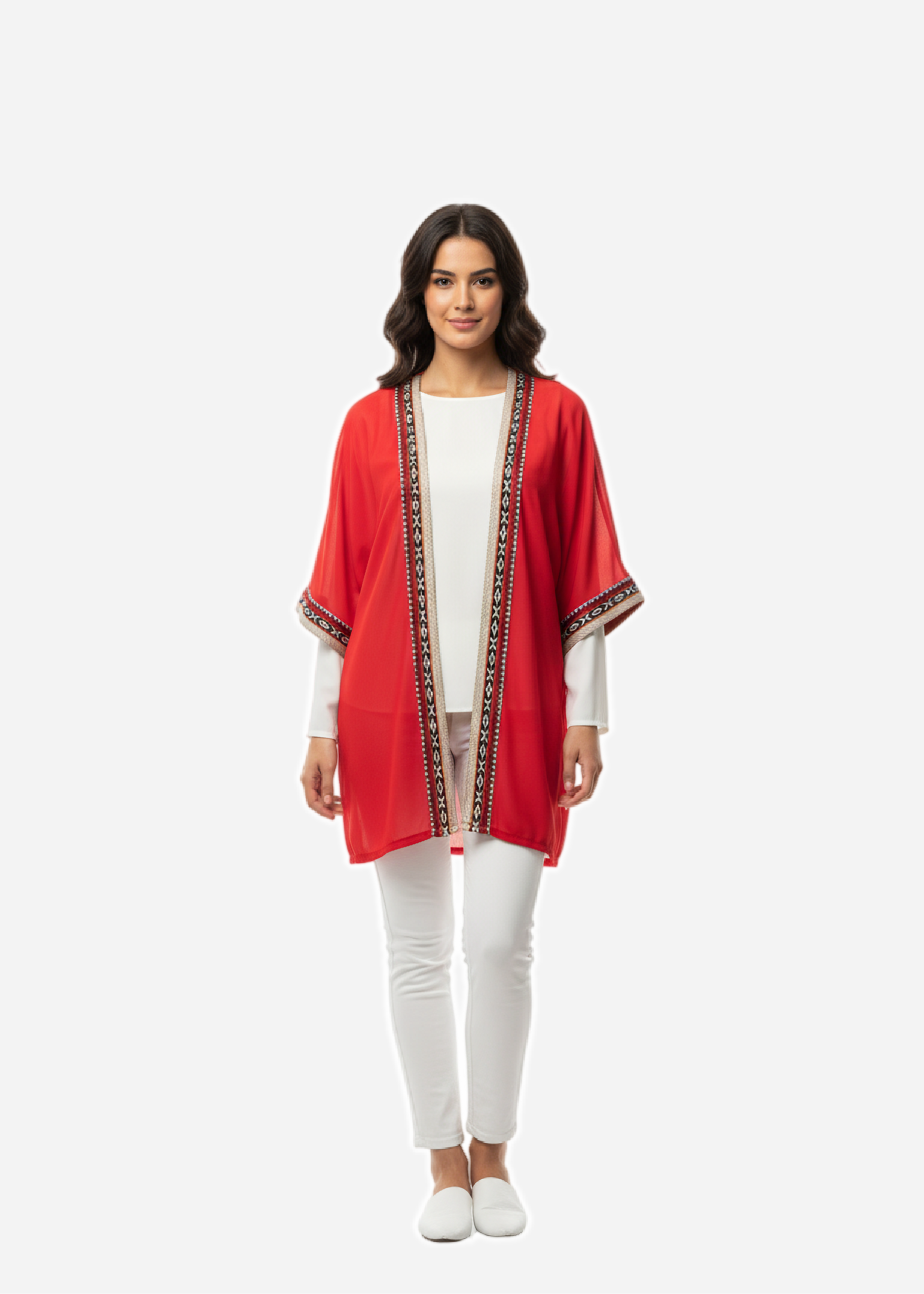 Woman wearing a red kimono-style jacket with white pants on a white background