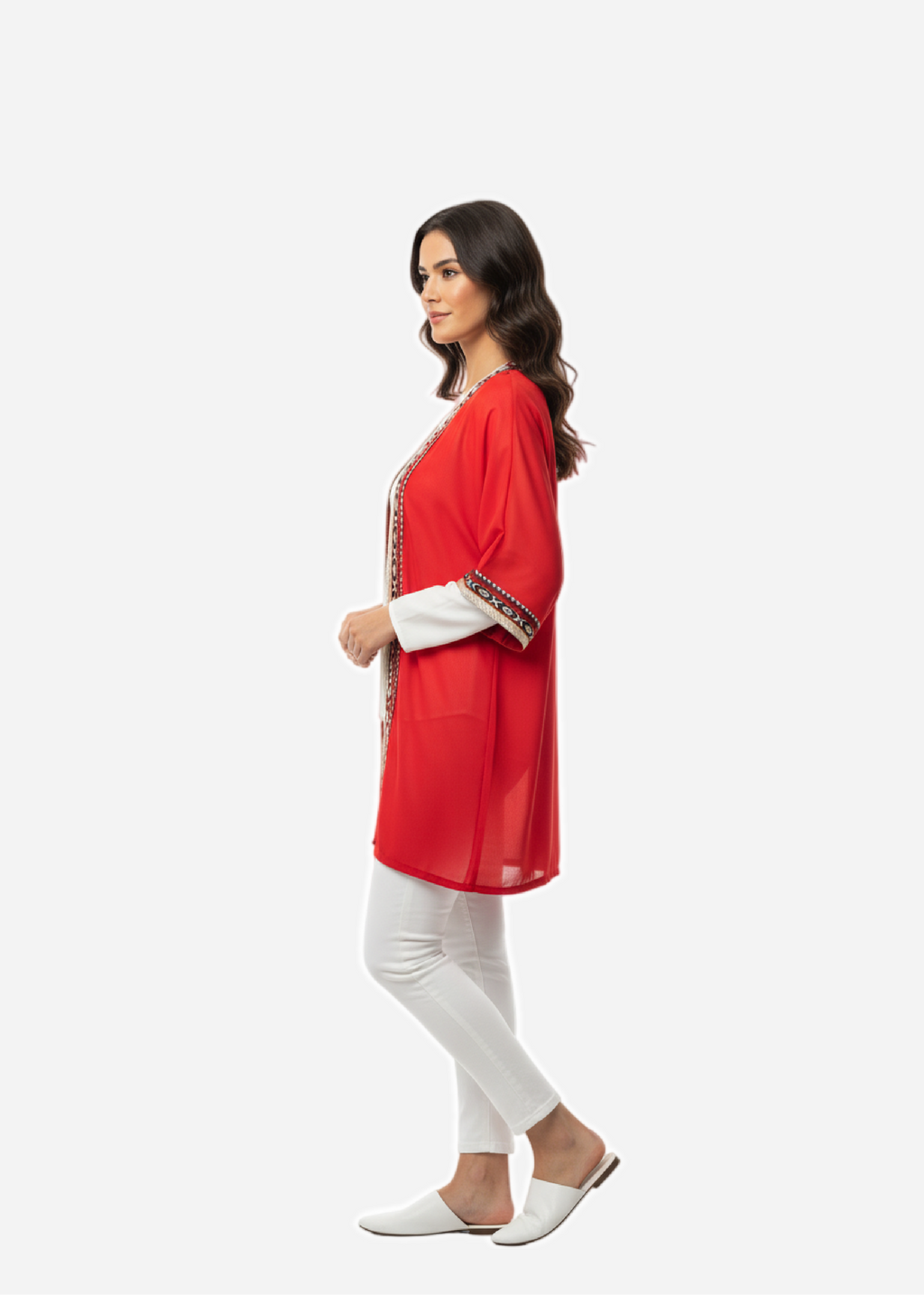 Woman wearing a red outfit with white pants on a white background