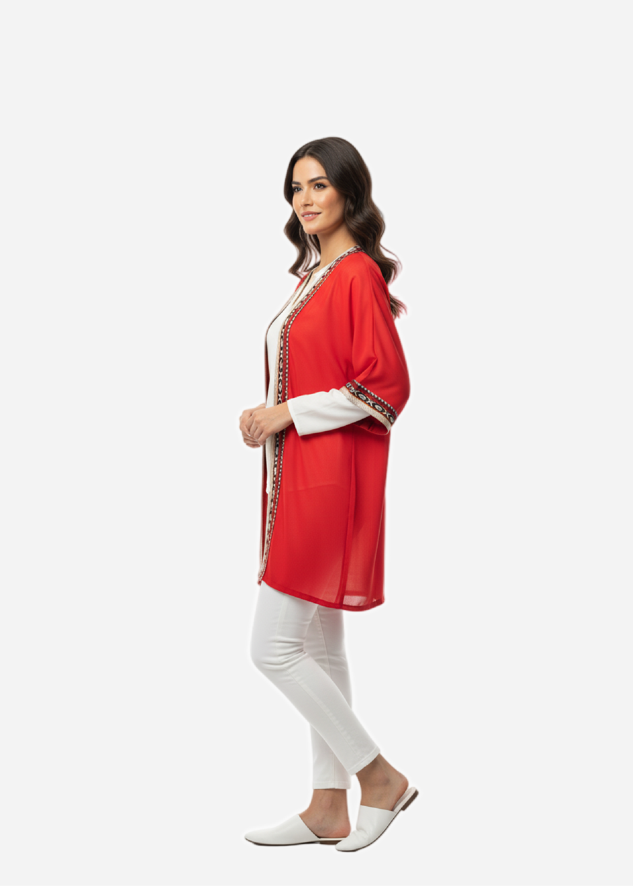 Woman wearing a red outfit with white pants on a white background